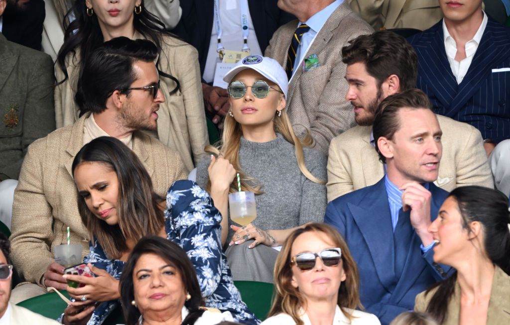 LONDON, ENGLAND - JULY 16: Jonathan Bailey, Ariana Grande, Andrew Garfield, Zawe Ashton and Tom Hiddleston watch Carlos Alcaraz vs Novak Djokovic in the Wimbledon 2023 men's final on Centre Court during day fourteen of the Wimbledon Tennis Championships at All England Lawn Tennis and Croquet Club on July 16, 2023 in London, England. (Photo by Karwai Tang/WireImage)