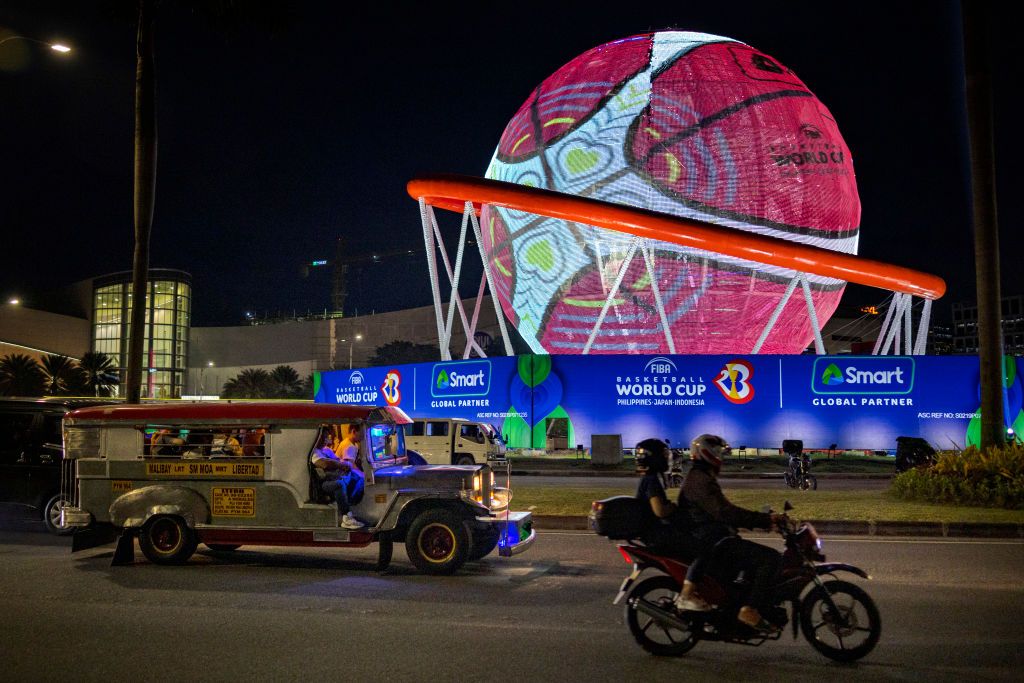MANILA, PHILIPPINES - AUGUST 22: Motorists pass a giant FIBA World Cup themed display ahead of the FIBA World Cup on August 22, 2023 in Pasay, Metro Manila, Philippines. The basketball world cup starts on August 25 in Philippines, Indonesia and Japan. (Photo by Ezra Acayan/Getty Images)