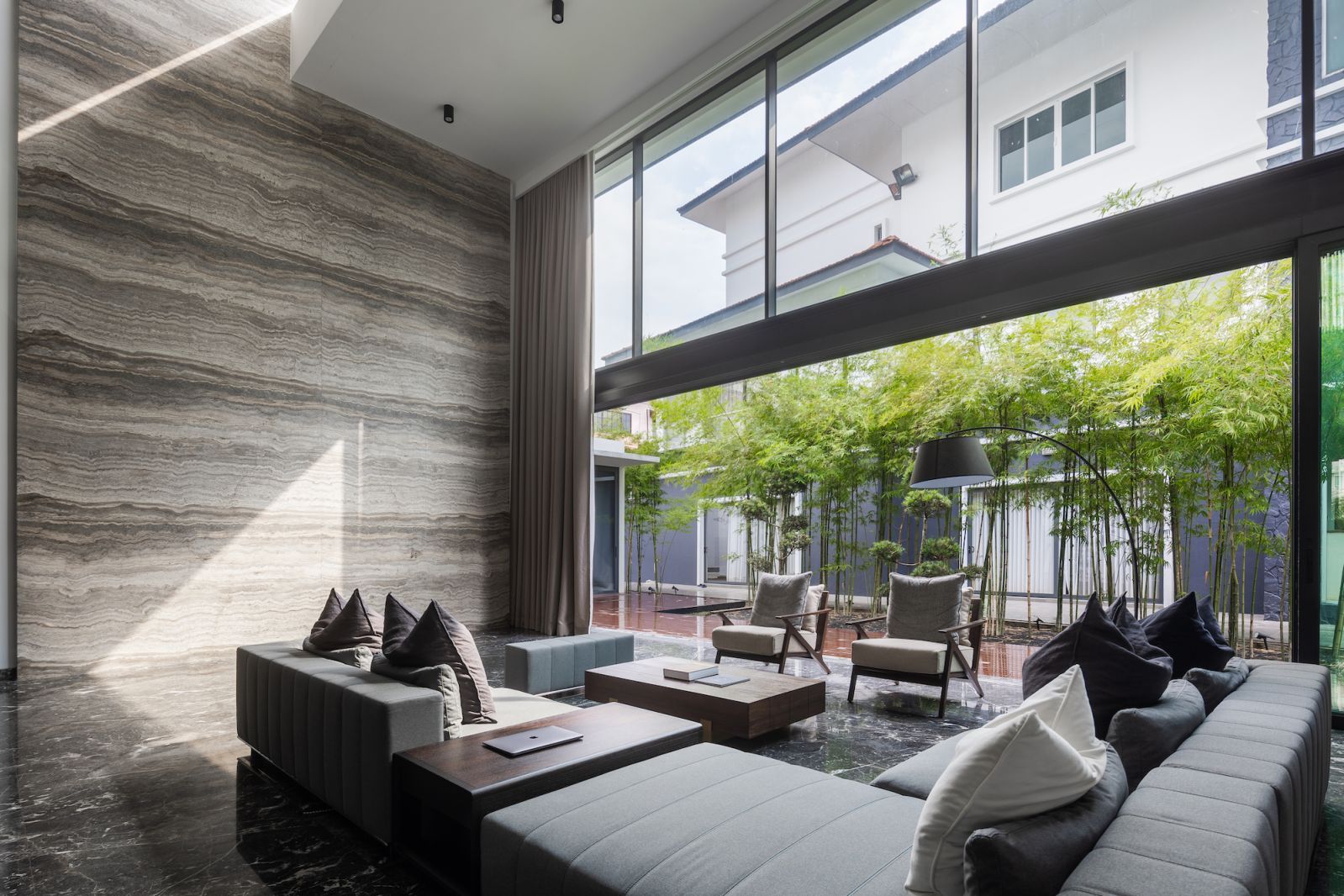 The living room has a double volume height ceiling