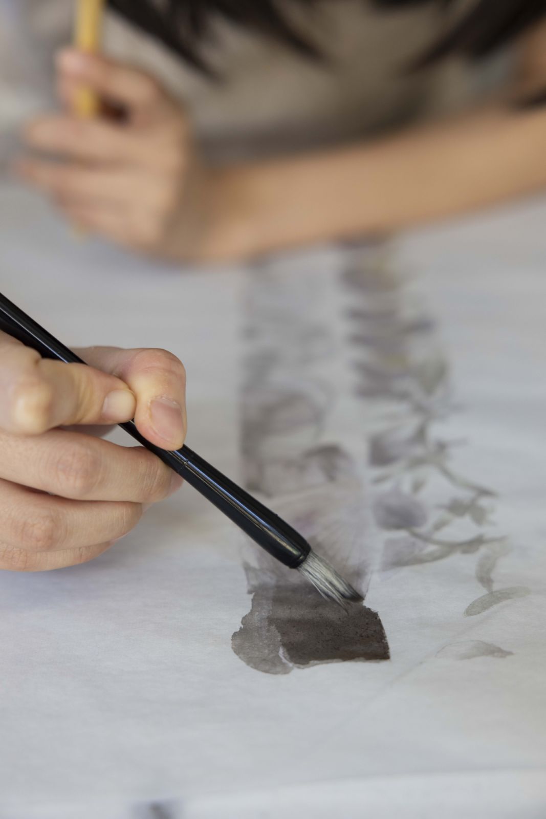 Practicing calligraphy on bamboo paper (Photo: Affa Chan)