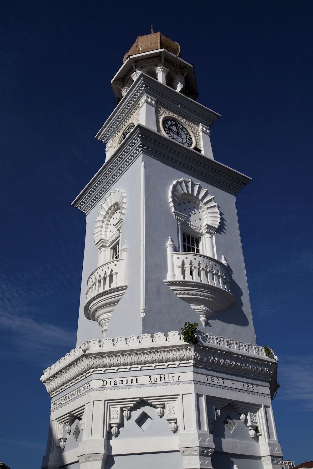 GEORGE TOWN, PENANG, MALAYSIA - 2009/09/21: To commemorate Queen Victoria's 1897 Diamond Jubilee, a Jubilee Clock Tower was constructed in George Town, Penang (at the time a British Straits Settlement) in the same year at junction of Lebuh Light (Light Street) and Lebuh Pantai (Beach Street). Built in a Moorish style, the tower is sixty feet tall, one foot for each year of Victoria's reign.. (Photo by John S Lander/LightRocket via Getty Images)