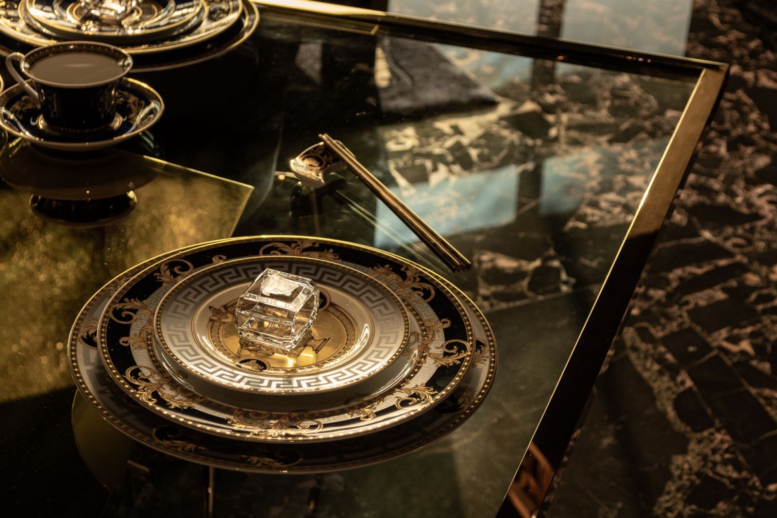 The tableware is all Versace of course