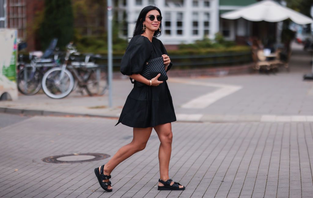 HAMBURG, GERMANY - JULY 27: Semra Hunt wearing Chanel black leather sandals and black clutch, Aje black mini dress and Celine shades on July 27, 2021 in Hamburg, Germany. (Photo by Jeremy Moeller/Getty Images)