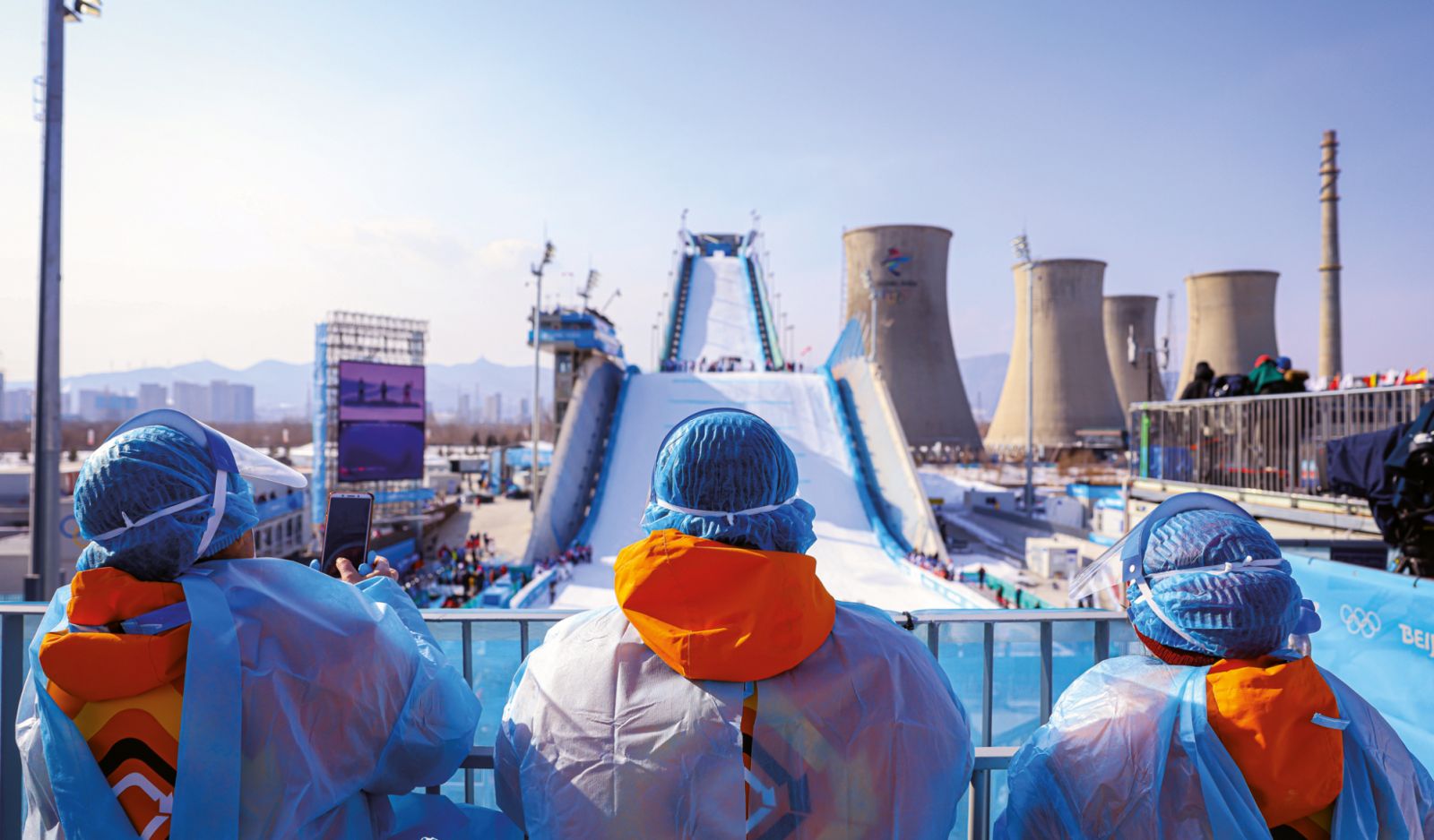 Staff in hazmat suits watching over the Yanqing National Alpine Skiing venue during the Beijing Winter Olympic Games 2022