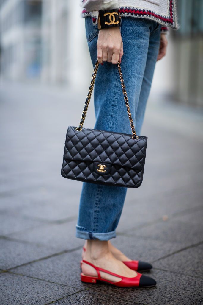 BERLIN, GERMANY - OCTOBER 31: (EDITORS NOTE: Image has been digitally enhanced.) Alexandra Lapp is seen wearing Jeans - Hiker Hover high waist, straight leg Jeans from Mother, Bag - Vintage Classic Chanel Flap-Bag âThe Chanel Iconic', Jewelry - Chanel, Vintage Beret with Chanel pin, Chanel - Slingpumps in red and black, Jacket - Classic Chanel Tweed Jacket on October 31, 2021 in Berlin, Germany. (Photo by Christian Vierig/Getty Images)