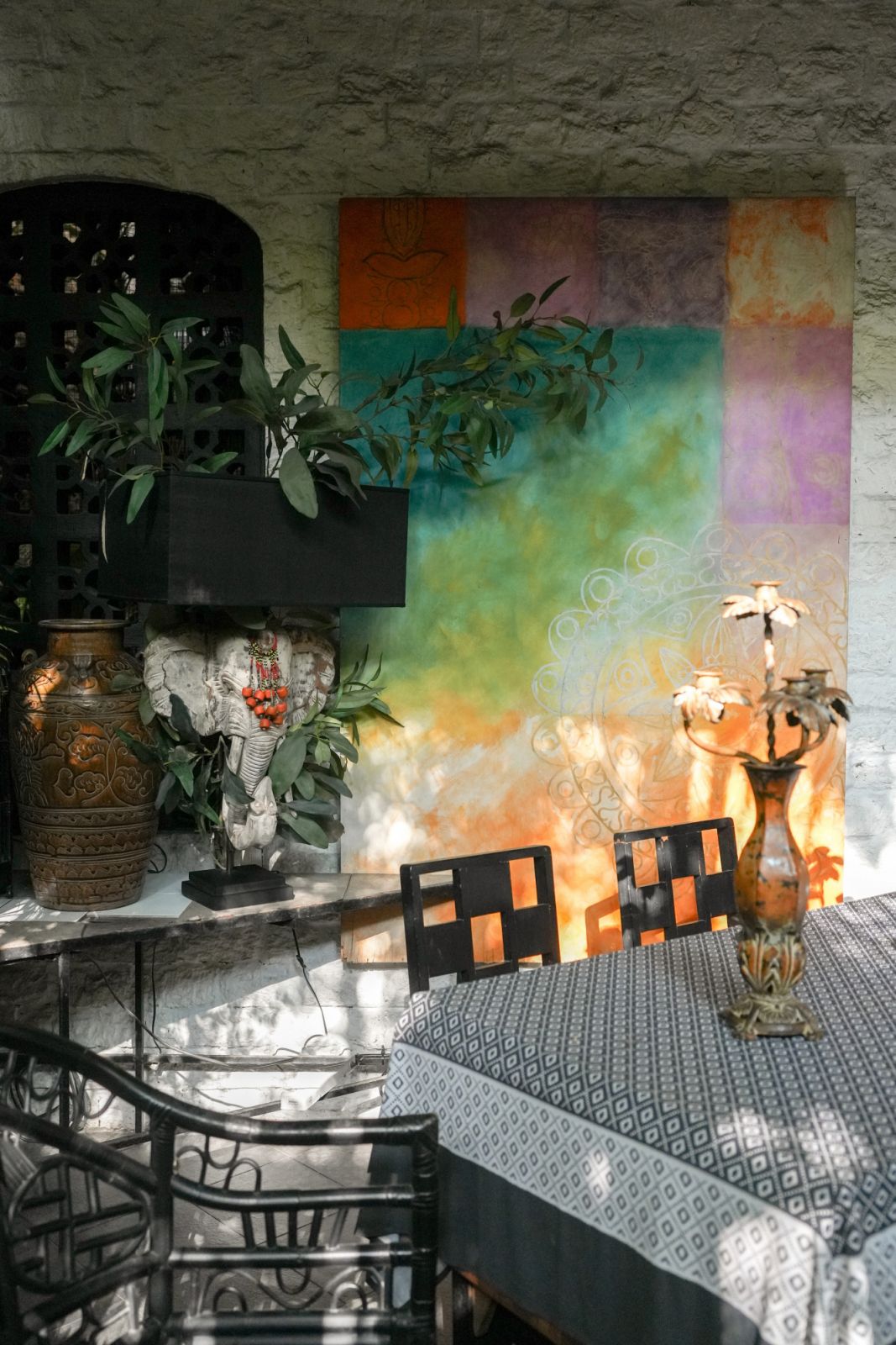 The painting is by Bunag’s Uncle Ernie, whom she credits for teaching her a love for layered bursts of colour