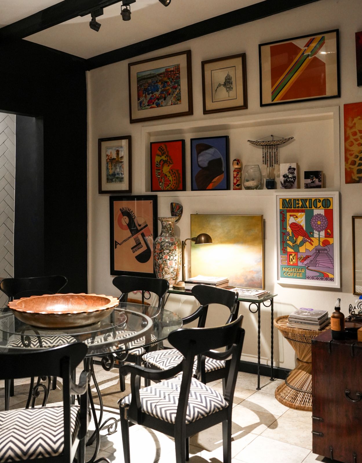 Vintage post-war dining chairs restored by Rica dela Merced tie in nicely with the Machuca tiles in the kitchen splashboard