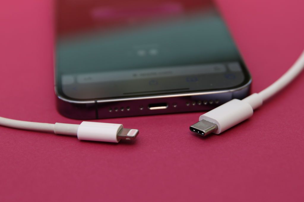 ILLUSTRATION - 10 September 2023, Berlin: An iPhone 14 Pro with a Lightning cable (left) and a USB-C cable (right). Apple will most likely replace its in-house Lightning connector with USB-C next Tuesday after the European Union decided that phone manufacturers must use the USB-C standard by the end of 2024. Photo: Christoph Dernbach/dpa (Photo by Christoph Dernbach/picture alliance via Getty Images)