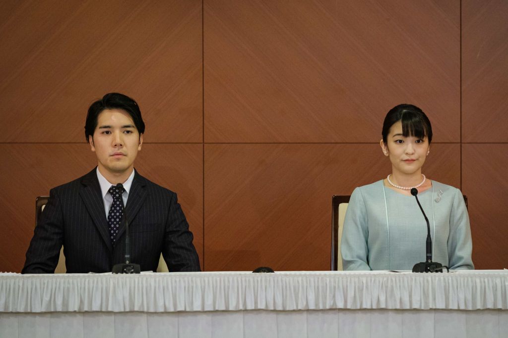 TOKYO, JAPAN - OCTOBER 26: Princess Mako (R), the elder daughter of Prince Akishino and Princess Kiko, and her husband Kei Komuro, a university friend of Princess Mako, pose during a press conference to announce their wedding at Grand Arc Hotel on October 26, 2021 in Tokyo, Japan. Princess Mako married Kei Komuro today at a registry office following a relationship beset with controversy following the revelation that Mr Komuroâs mother was embroiled in a financial dispute with a former fiancé. Following t