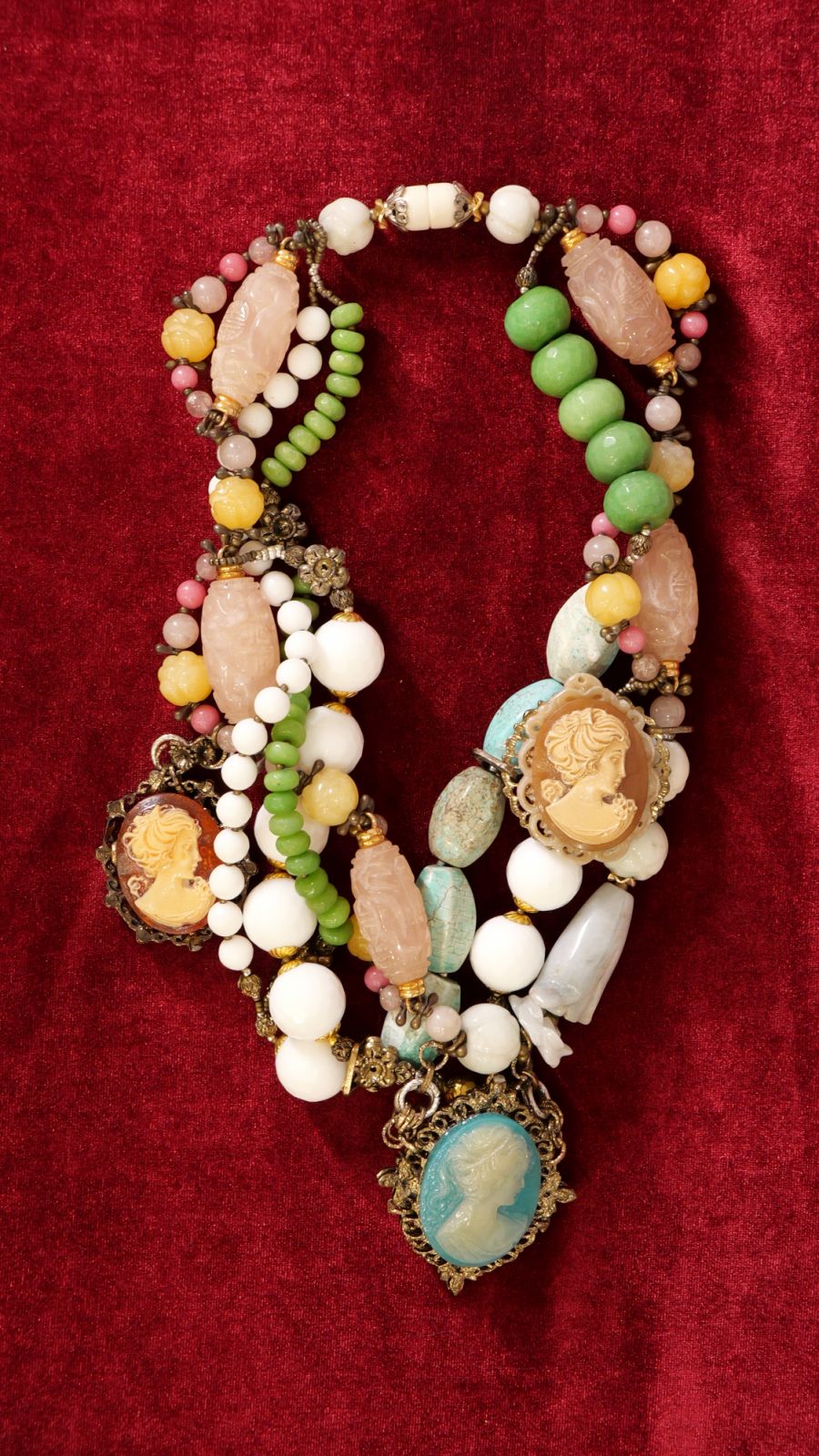 A one-of-a-kind, Victorian-inspired necklace in jade, turquoise, white peridot, chalcedony, and antique hardware.