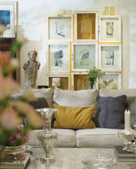 The jeweller combines vintage silver with modern accents to create a classy vignette; Her family home is brimming with heirloom pieces and curios from her trips abroad