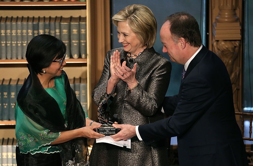 Democratic presidential candidate and former U.S. Secretary of State Hillary Clinton (C) presents the Hillary Rodham Clinton Award for Advancing Women in Peace and Security to Dr. Miriam Coronel-Ferrer (L), who served as the Chief Negotiator of the Philippines Government in the Mindanao Peace Talks, at Georgetown University April 22, 2015 in Washington, DC. (Photo: Win McNamee/Getty Images)