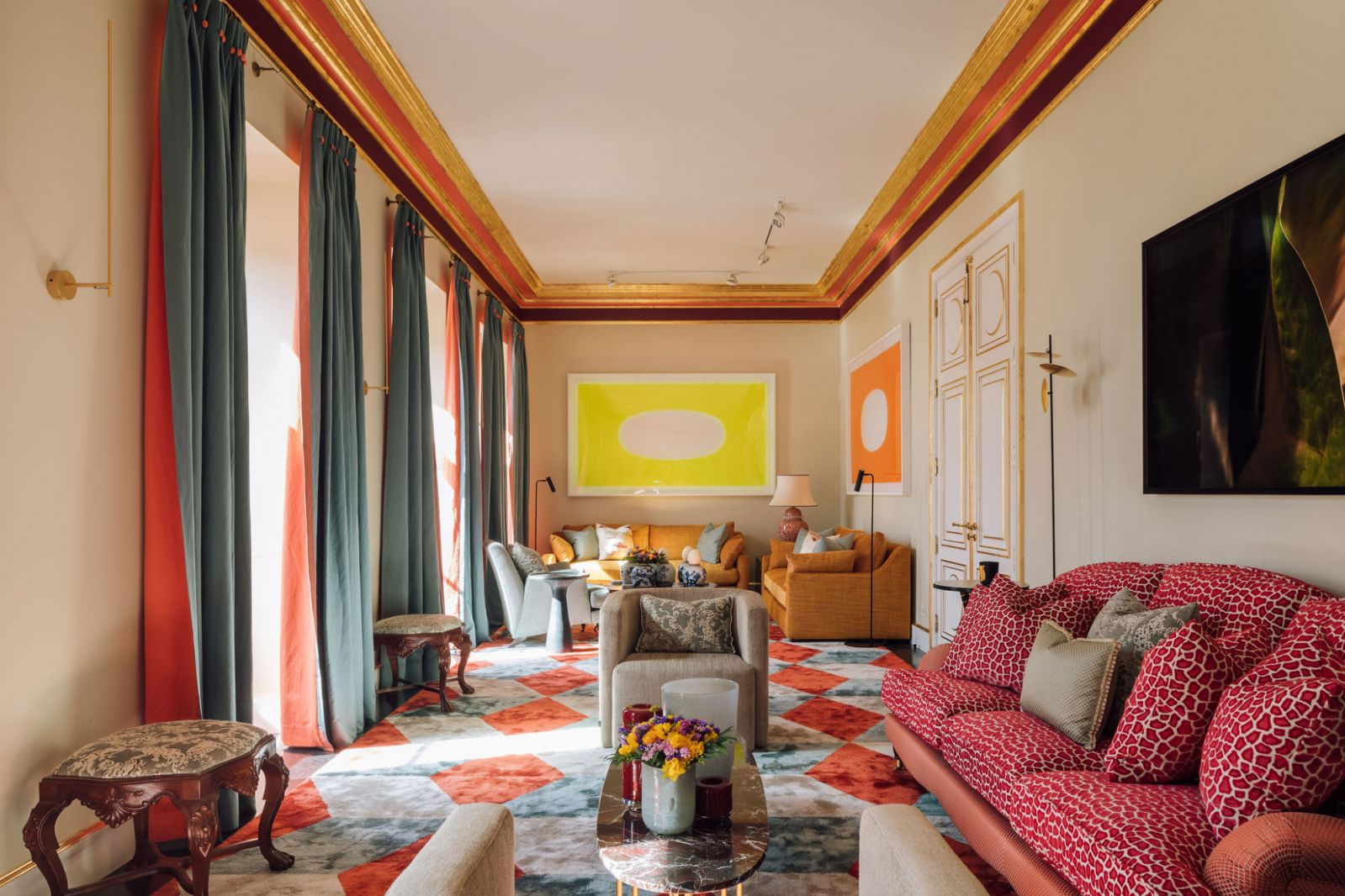 living room sectioned into two with different couches and colours