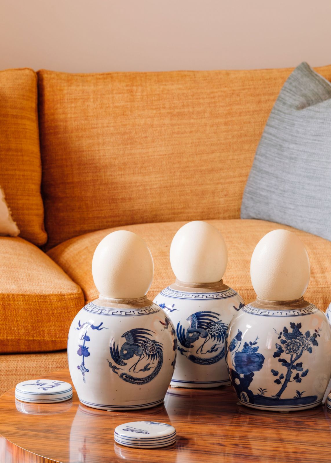 blue and white porcelain furniture with orange couch