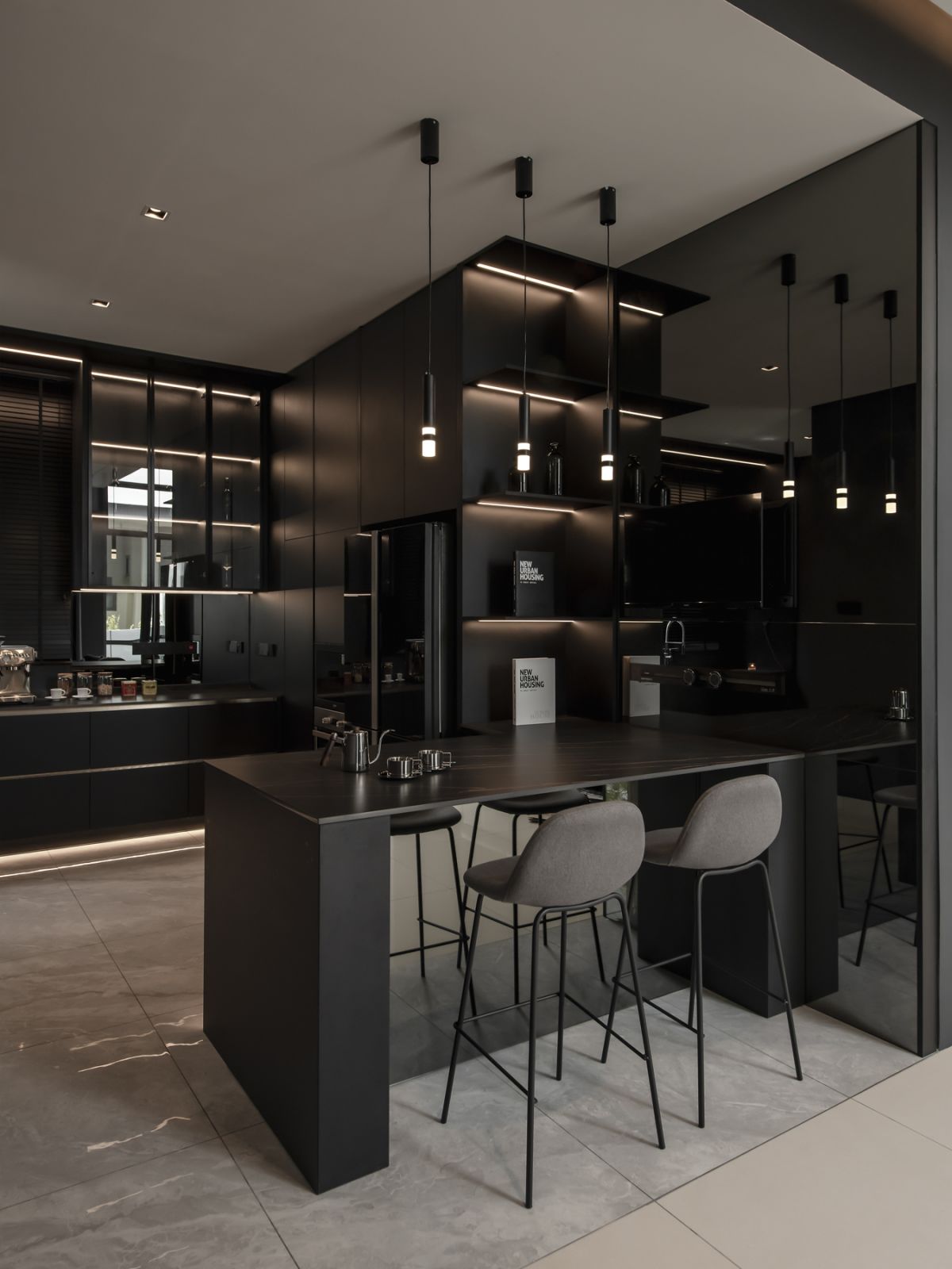 The mirrored surface creates the illusion of space to this cosy island nook