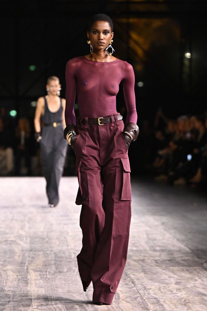 PARIS, FRANCE - SEPTEMBER 26: (EDITORIAL USE ONLY - For Non-Editorial use please seek approval from Fashion House)  (EDITORS NOTE: Image contains nudity.) A model walks the runway during the Saint Laurent Womenswear Spring/Summer 2024 show as part of Paris Fashion Week on September 26, 2023 in Paris, France. (Photo by Stephane Cardinale - Corbis/Corbis via Getty Images)