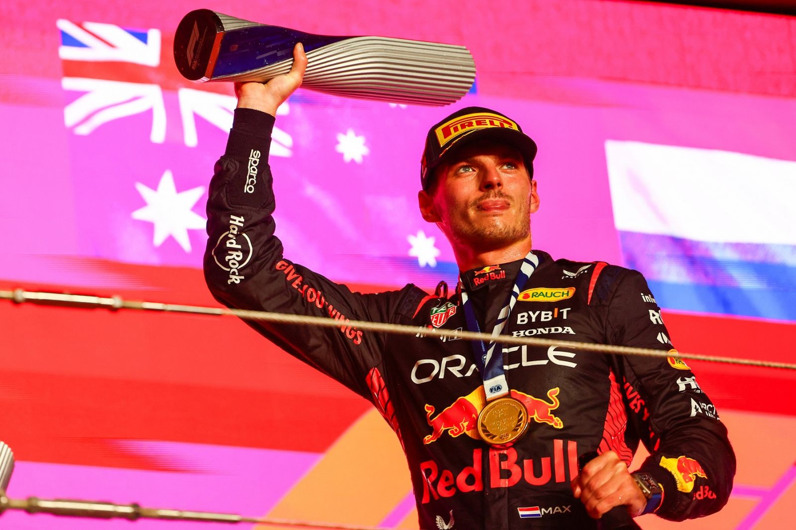 LUSAIL CITY, QATAR - OCTOBER 08: Race winner Max Verstappen of the Netherlands and Oracle Red Bull Racing celebrates on the podium during the F1 Grand Prix of Qatar at Lusail International Circuit on October 08, 2023 in Lusail City, Qatar. (Photo by Mark Thompson/Getty Images) // Getty Images / Red Bull Content Pool // SI202310080541 // Usage for editorial use only //