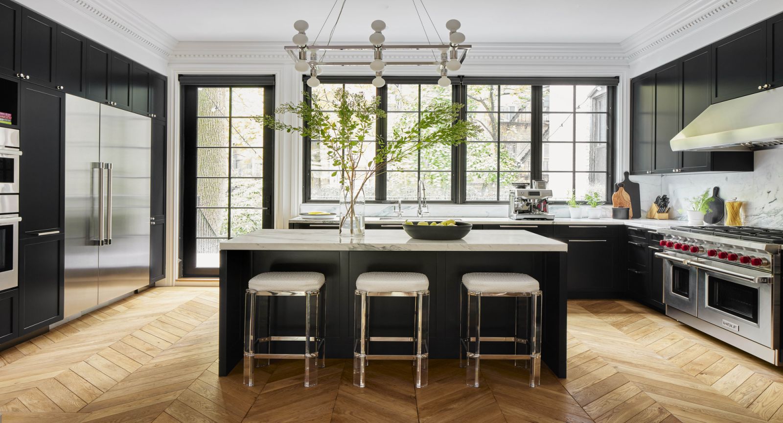 The windows overlooking the streets and garden allow for plenty of natural light, while the chevron flooring provides a sense of spaciousness