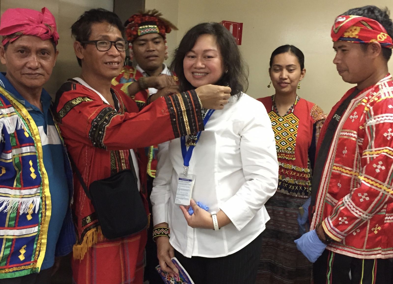 Almira Astudillo Gilles receives a gift from indigenous visitors to the Field Museum of Natural History in Chicago.
