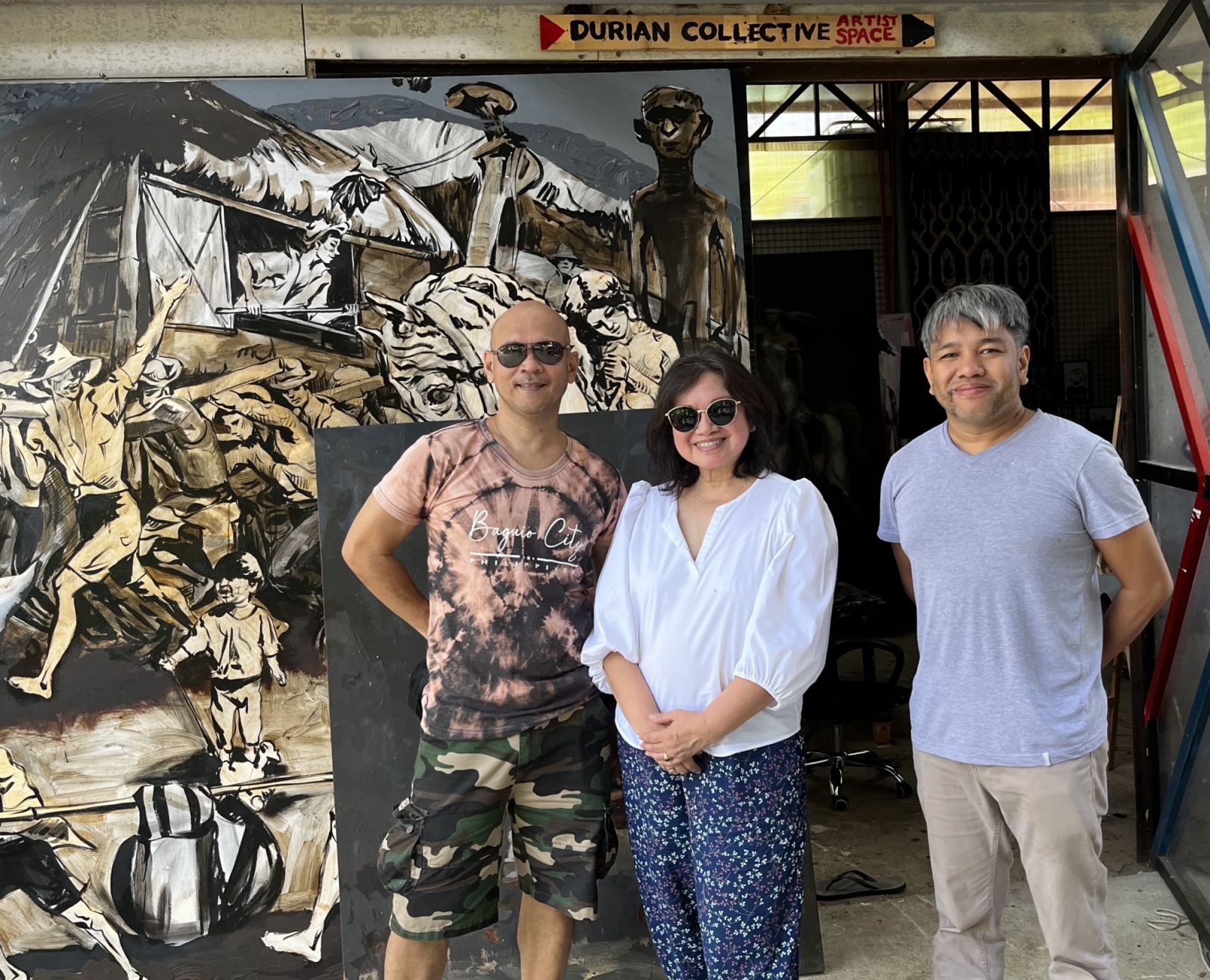 Almira Gilles (centre) pictured with Orley Ypon and Otto Neri of the Durian Collective.