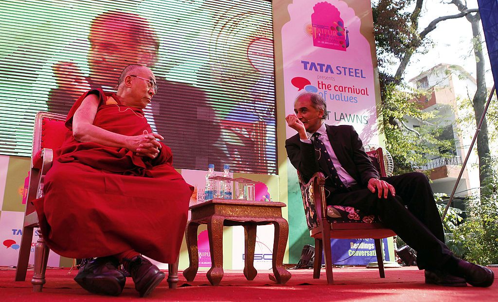 Tibetan Spiritual Leader Dalai Lama in conversation with Pico Iyer on the topic 'Kinships of Faiths: Finding the Middle Way' at the DSC DSC Jaipur Literature Festival at Diggi Palace on January 24, 2013 in Jaipur, India. (Photo by M Zhazo/Hindustan Times via Getty Images)