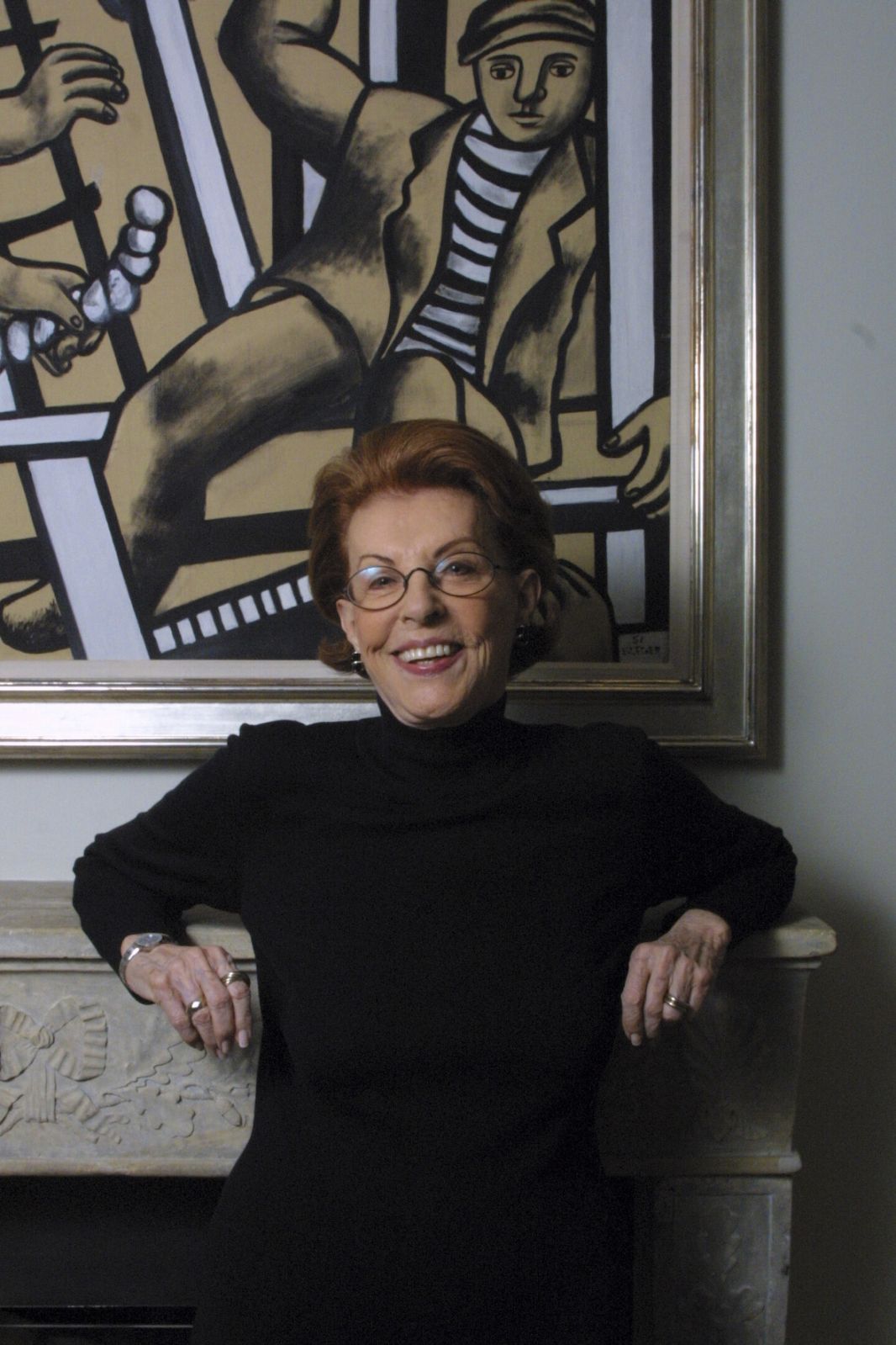FILE -- The art collector and patron Emily Fisher Landau sits in front of Fernand Leger's "Etude pour Les Constructeurs" ("Study for Les Constructeurs"), 1951, in the dining room of her home, in Manhattan on Jan. 31, 2002. Fisher Landau, a New Yorker who used a Lloyd's insurance settlement from a spectacular jewel heist in her apartment to fund what would become one of America's premier collections of contemporary art, died on March 27, 2023 in Palm Beach, Fla. She was 102. (Chester Higgins Jr./The New York