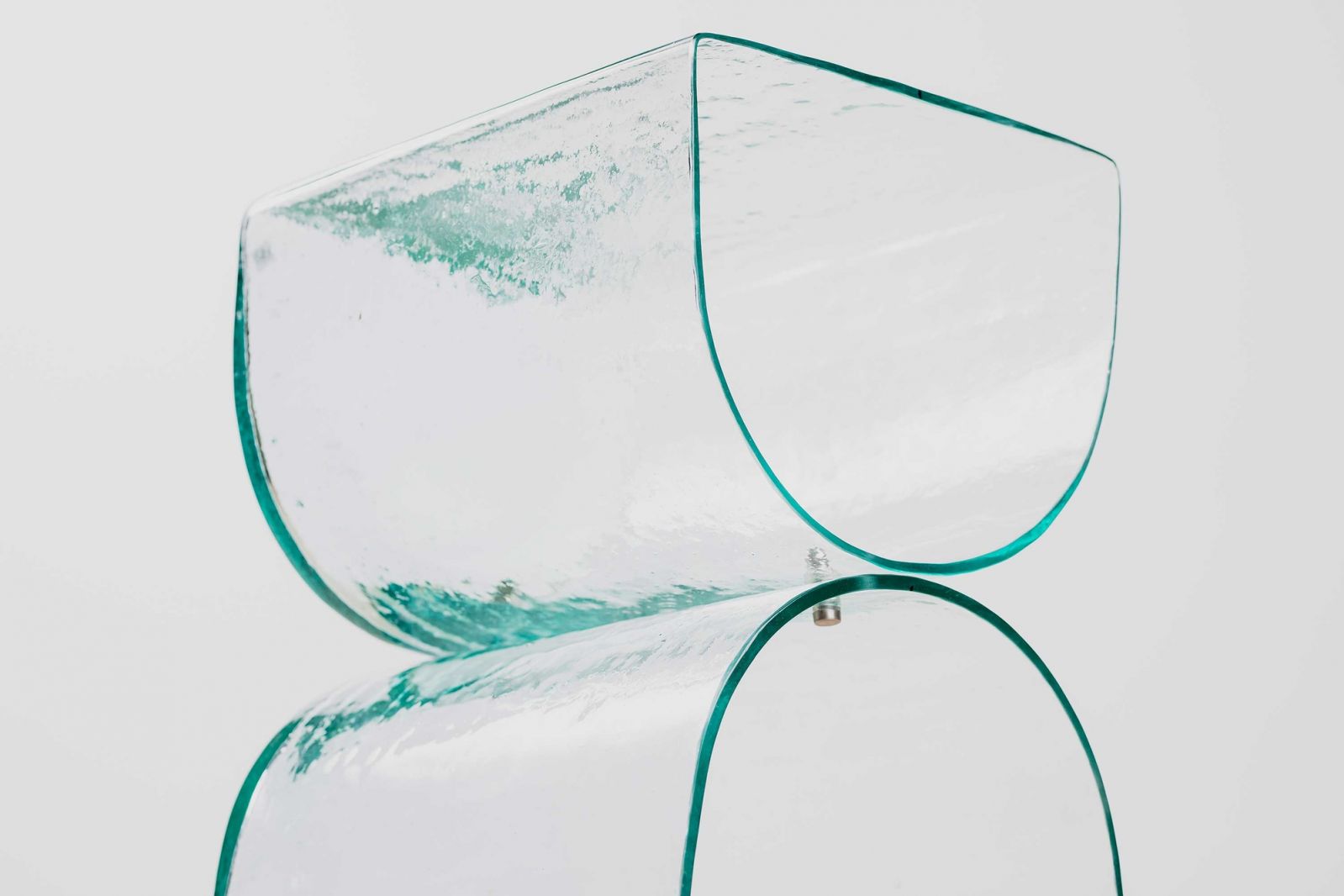 The glass side table is made using traditional glassblowing methods from Hadinata's home region (Photo: Studio Periphery)