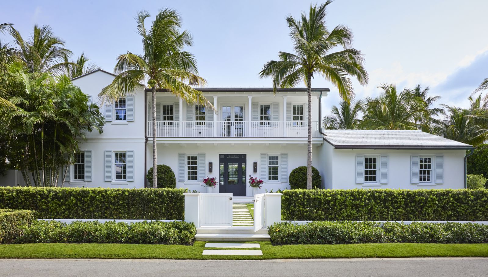 Sea views and palm trees provide the perfect backdrop for this beachside home