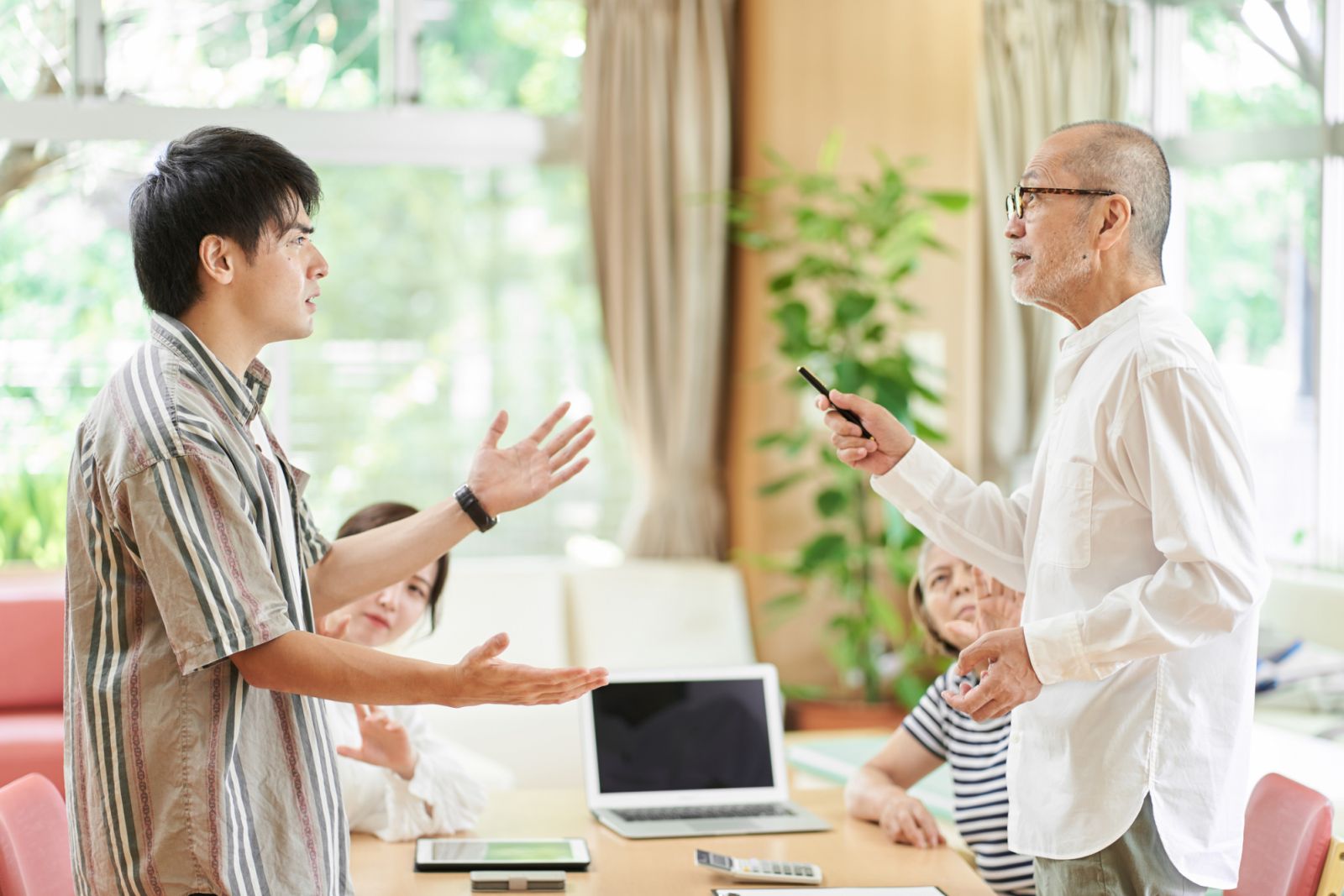 Young couple and old couple quarreling