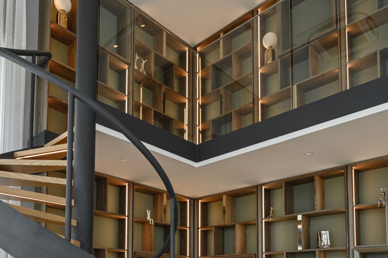 The spiral staircase connects the mezzanine floor