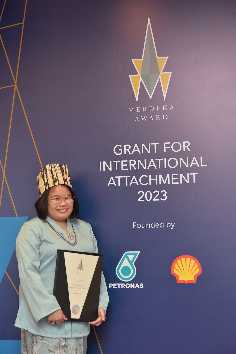 Masni at the The Merdeka Award Grant for International Attachment ceremony in August 2023