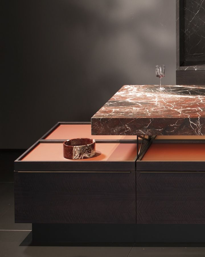 Customisable frames are used inside each drawer for a harmonious combination of black aluminium and smoked oak
