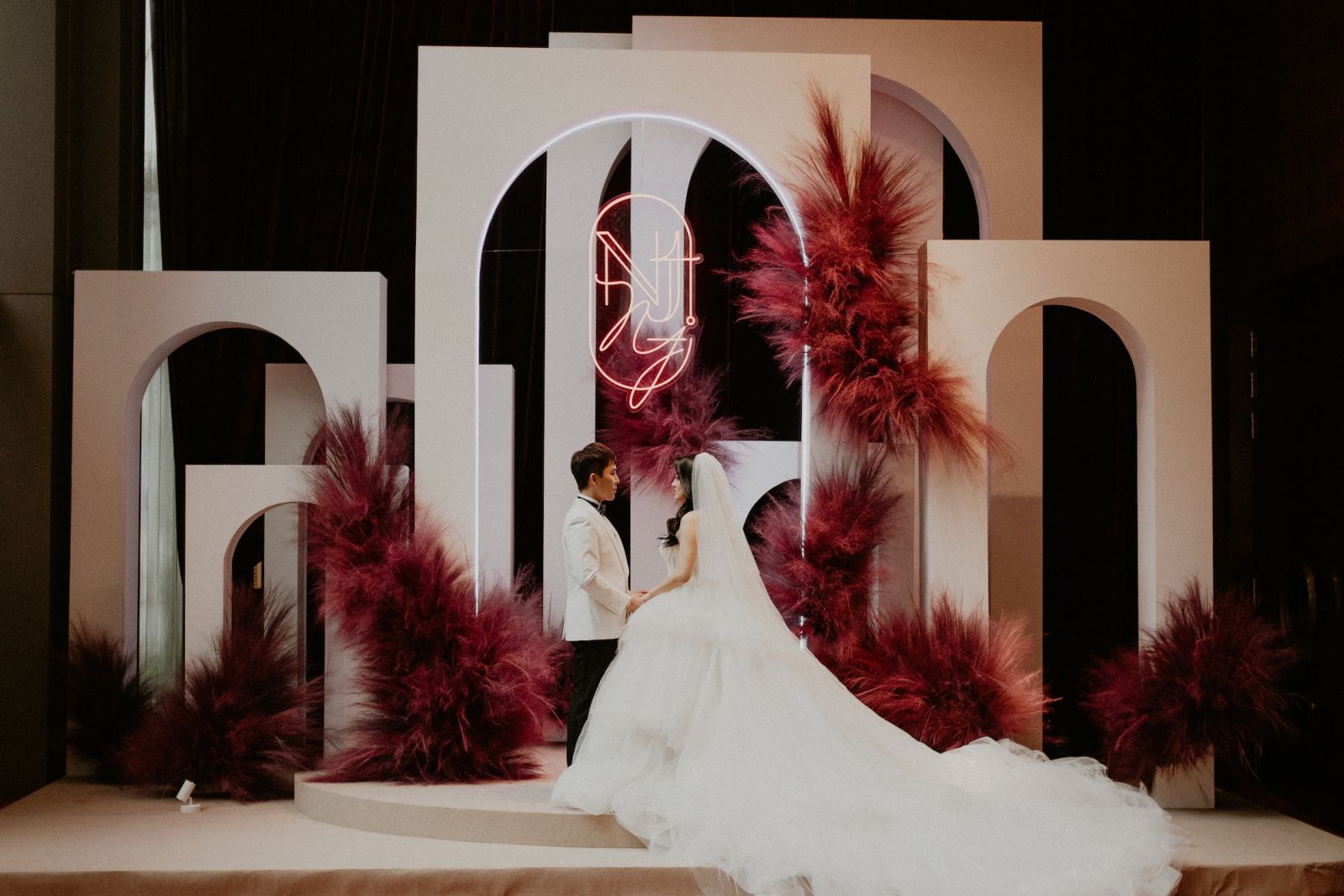 Nickson and Jing Thing against a stunning backdrop decor by Within the Occasions