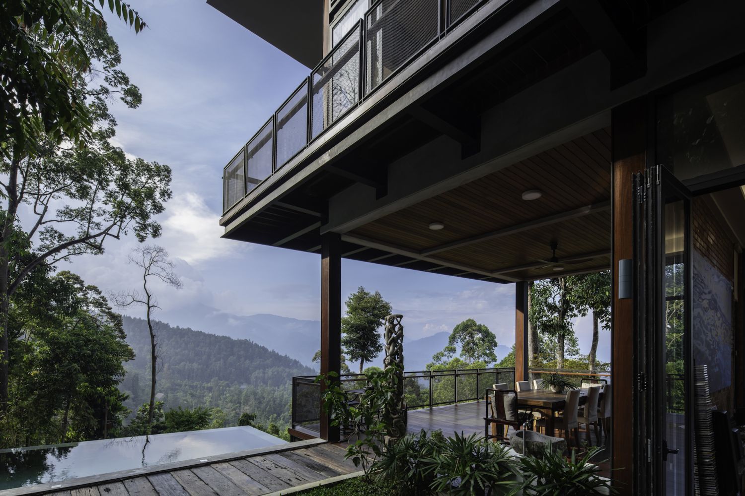 The infinity pool disappears into the green (Photo: Lawrence Choo)
