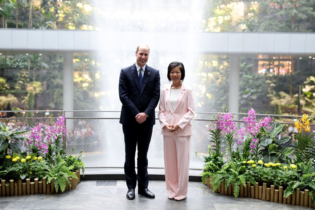 Prince William, Prince of Wales poses with Sim Ann, Senior Minister of State for Foreign Affairs and Senior Minister of State for National Development during his visit to the HSBC Rain Vortex at Jewel Changi Airport on day one of his visit to Singapore on November 05, 2023 in Singapore. The Prince of Wales is visiting Singapore to attend the Earthshot Prize Awards and will also carry out several engagements related to environmental issues. (Photo by Chris Jackson/Getty Im