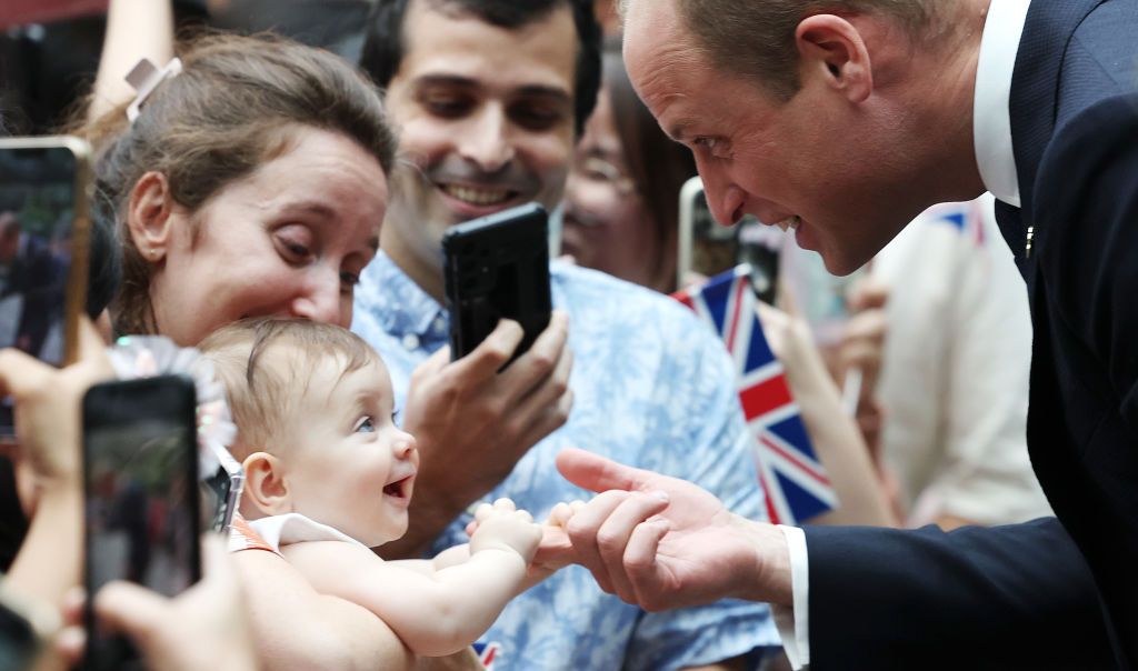 8 month old Albane Costa holds the finger of Prince William, Prince of Wales during his visit to the HSBC Rain Vortex at Jewel Changi Airport on day one of his visit to Singapore on November 05, 2023 in Singapore. The Prince of Wales is visiting Singapore to attend the Earthshot Prize Awards and will also carry out several engagements related to environmental issues. (Photo by Chris Jackson/Getty Images)