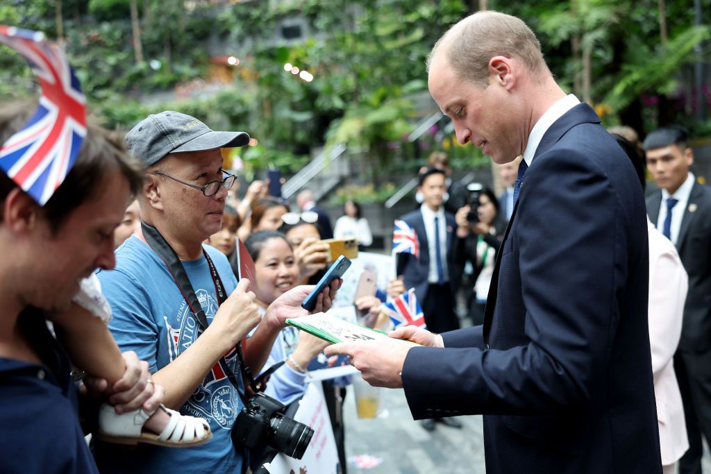 SINGAPORE, SINGAPORE - NOVEMBER 05: Prince William, Prince of Wales greets members of the public during his visit to the HSBC Rain Vortex at Jewel Changi Airport on day one of his visit to Singapore on November 05, 2023 in Singapore. The Prince of Wales is visiting Singapore to attend the Earthshot Prize Awards and will also carry out several engagements related to environmental issues. (Photo by Chris Jackson/Getty Images)