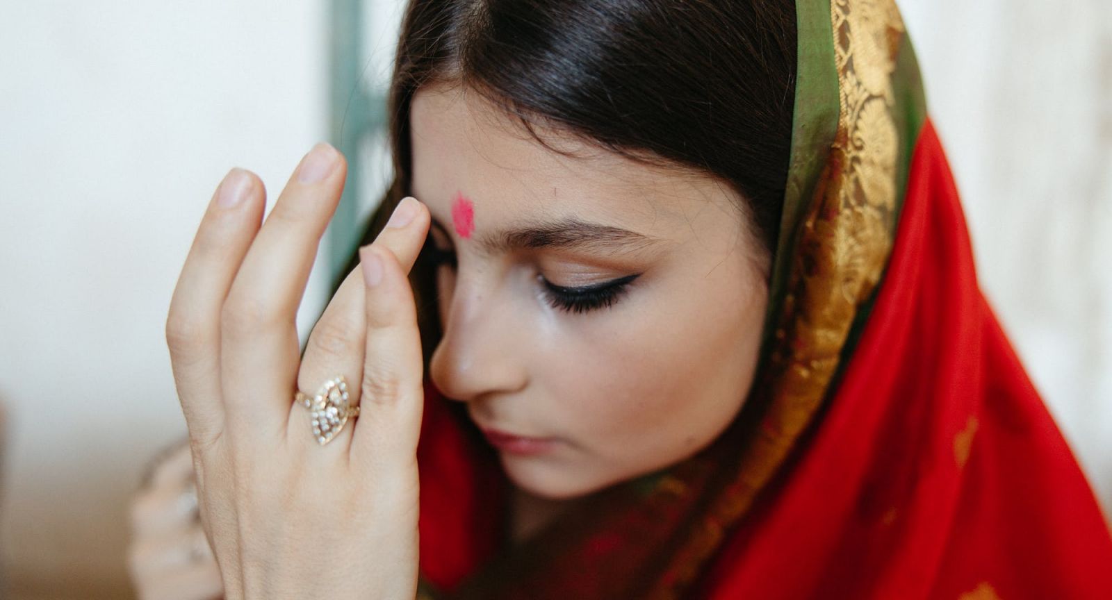 It is an auspicious activity to have a bindi placed for you at the door during Deepavali (Photo: Anastasia Shuraeva)