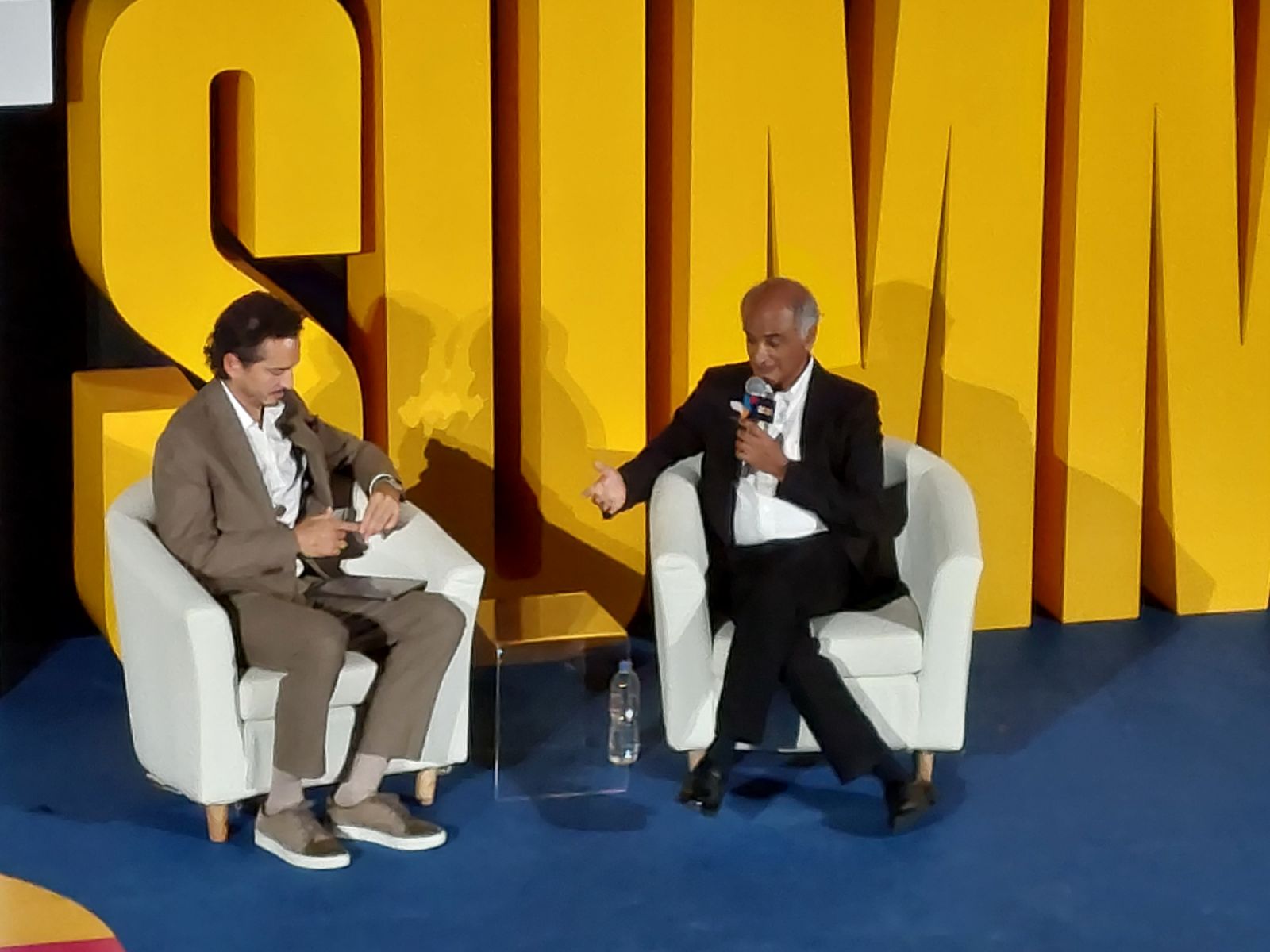 Filmmaker, artist, activist and Summit MC Sean Lee-Davies interviews travel writer Pico Iyer (Photo: Rick Boost)