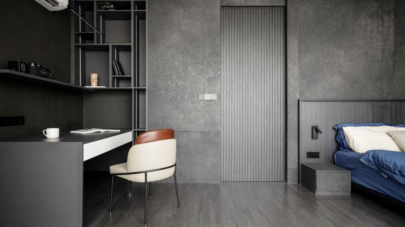 This bedroom features darker tones