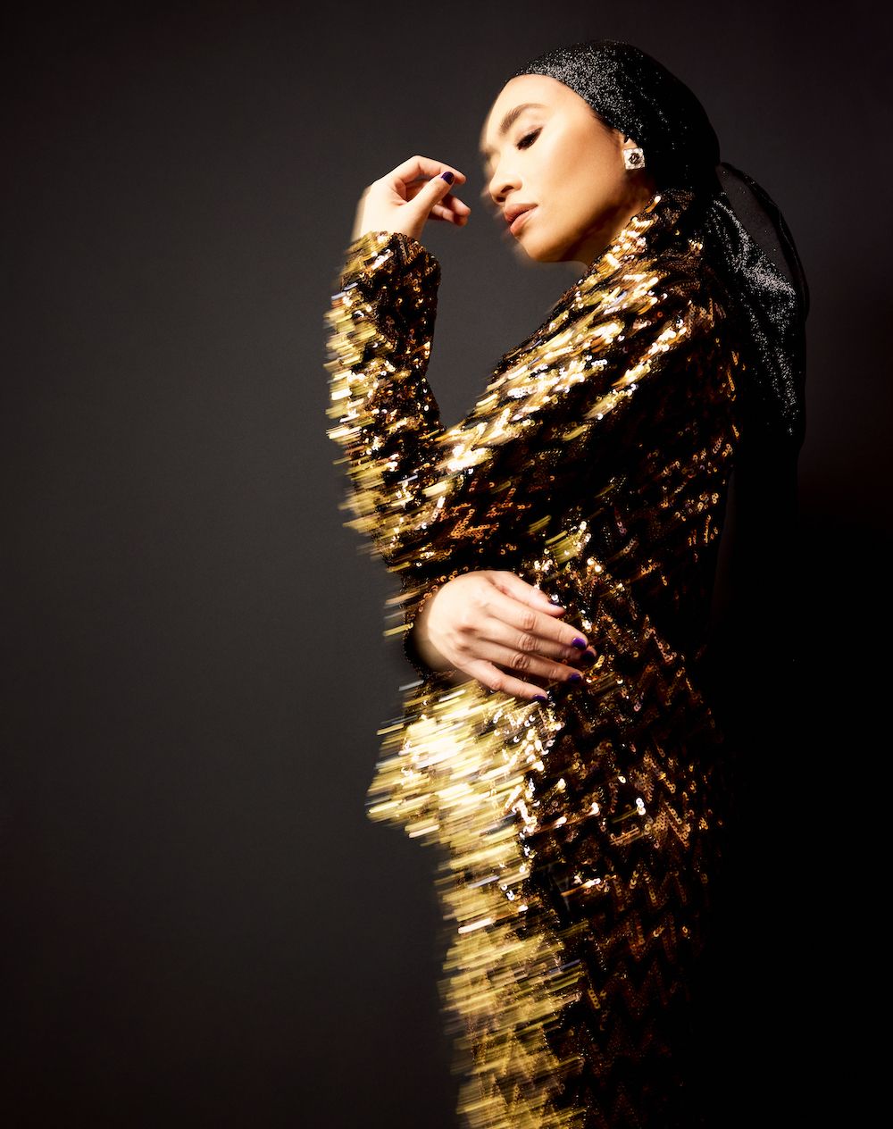 On Yuna: Chanel earrings and necklace, Chanel jacket