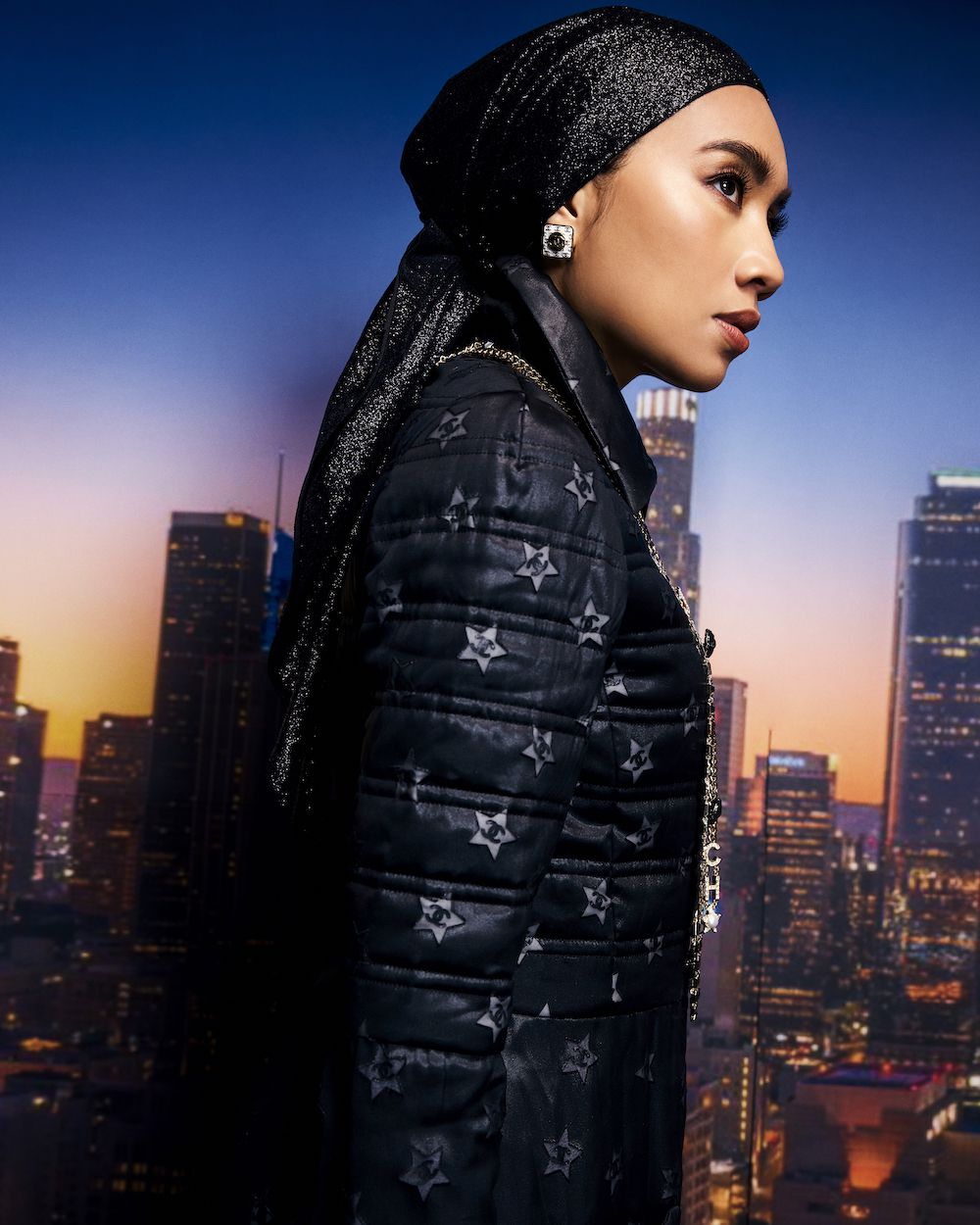 On Yuna: Chanel earrings and necklace, Chanel jacket