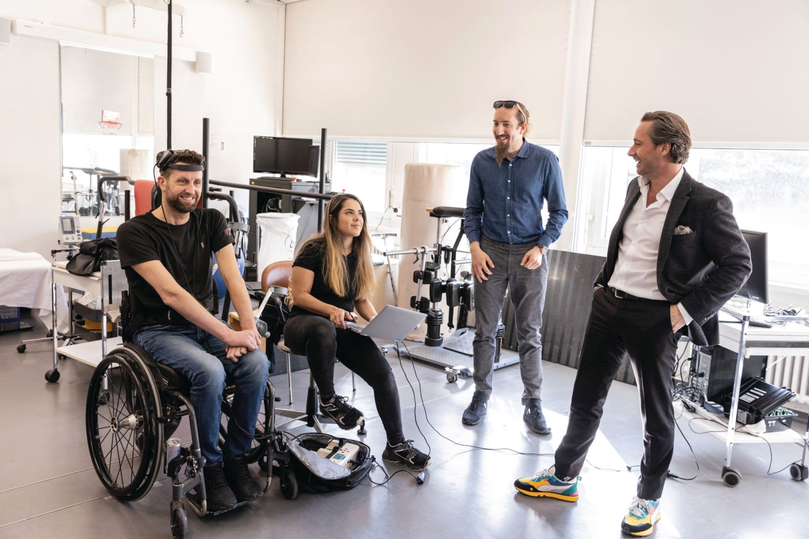 NeuroRestore team members Andrea Galvez and Jimmy Ravier and Grégoire Courtine prepare for Oskam to take his first step after surgery (Photo: courtesy of Rolex)