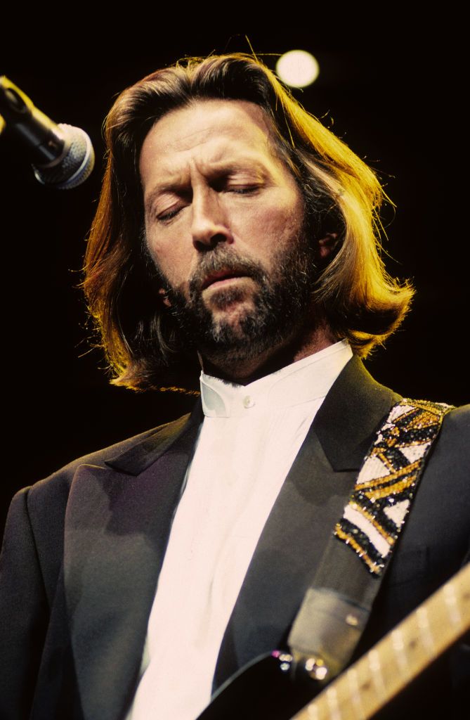 Close-up of British Rock and Blues musician Eric Clapton as he plays guitar during a performance, part of his series of '24 Nights' concerts, at the Royal Albert Hall, London, England, March 4, 1991. (Photo by Gene Shaw/Getty Images)