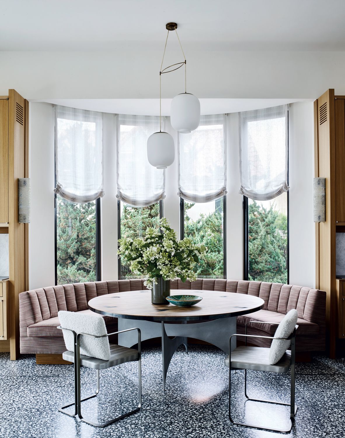 This delightful dining nook features snug seating and plenty of natural light