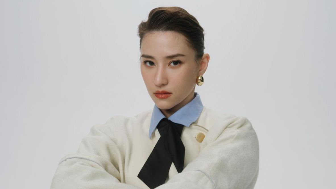 Laurinda Ho in a Gucci outfit, with Grey Matter earrings