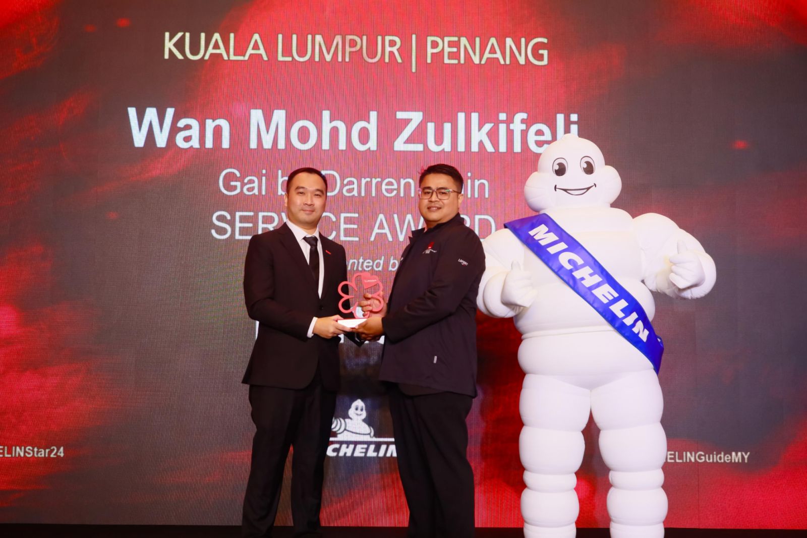 Wan Mohd Zulkifeli of DC Restaurant with his Michelin Guide Service Award