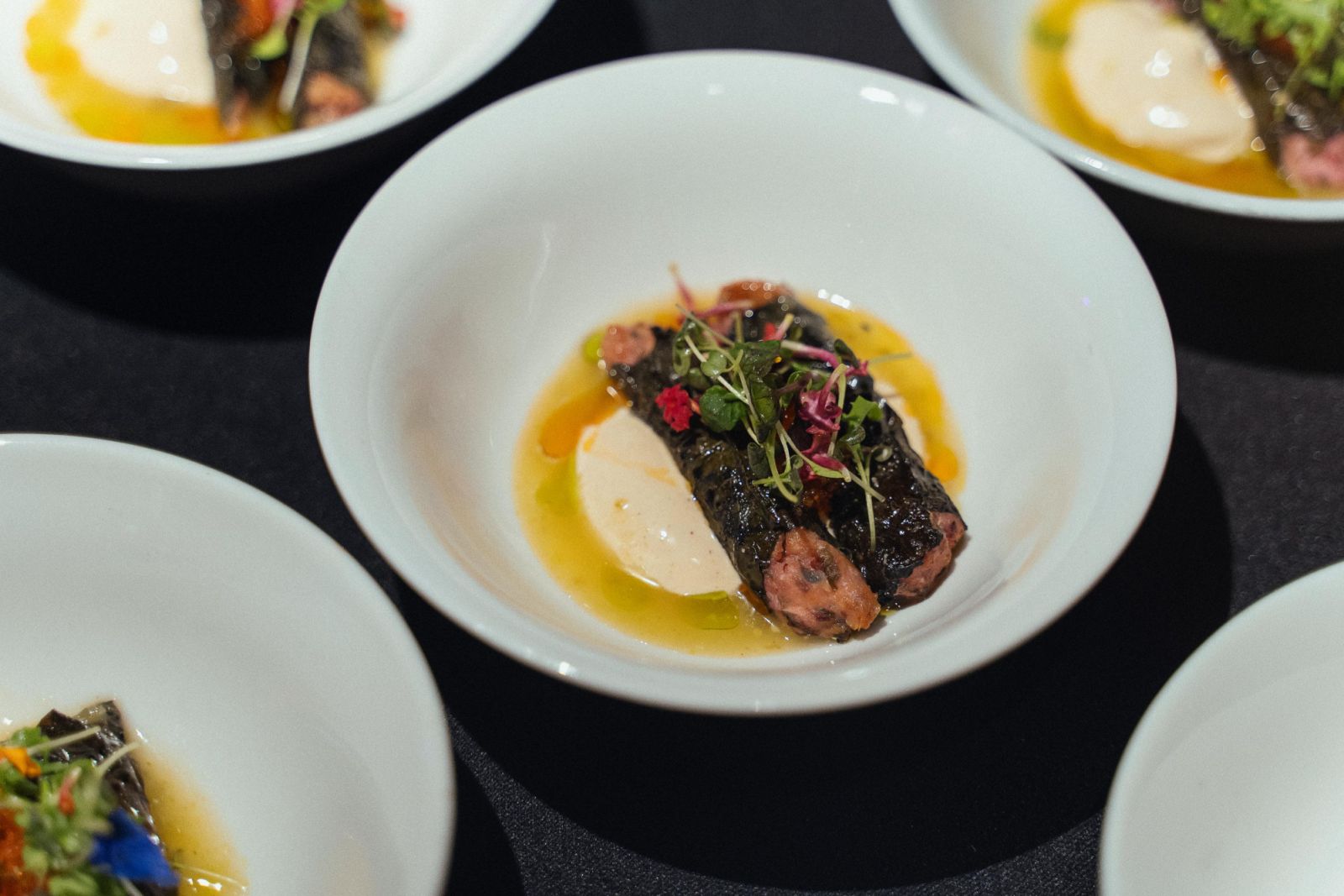Maxine Ngooi’s modern dolma mahshi with betel leaf and vinegared mackerel, hake, cod, and prawns, and finished with an escabeche and nutmeg-infused cream