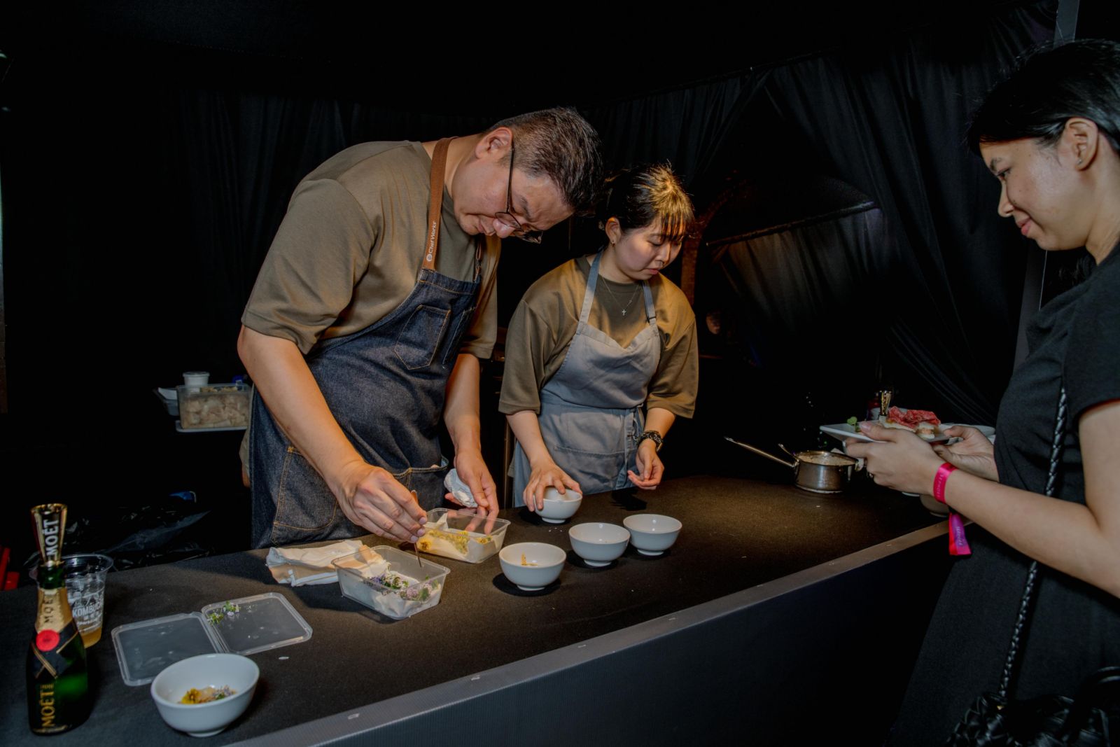 Marvas Ng and his assistant of Path serving diners