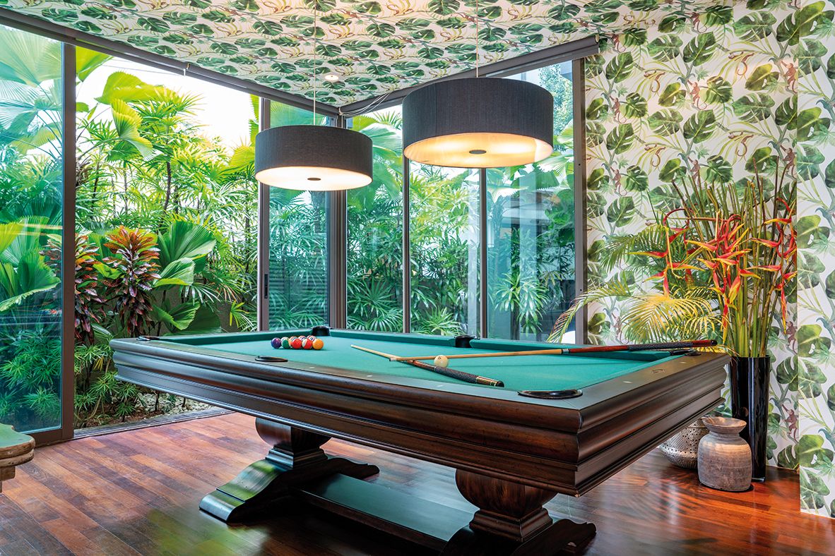 Palm motifs applied to an entertainment den that reference the garden’s verdant greenery (Photo: Design Intervention)